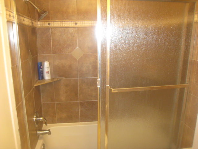 upstairs tiled shower