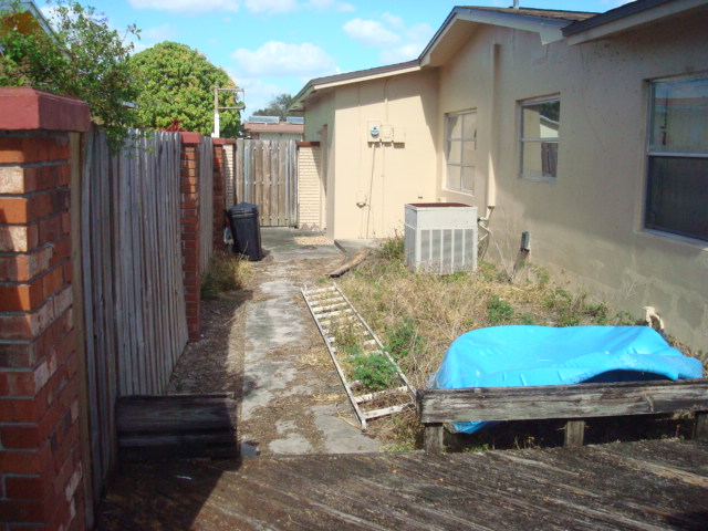 WEST SIDE OF HOME LOOKING NORTH
