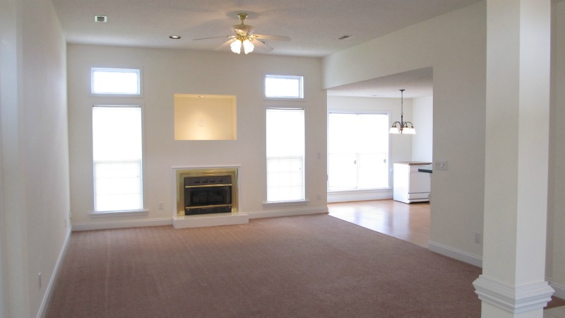 Great room with gas log fireplace and TV niche