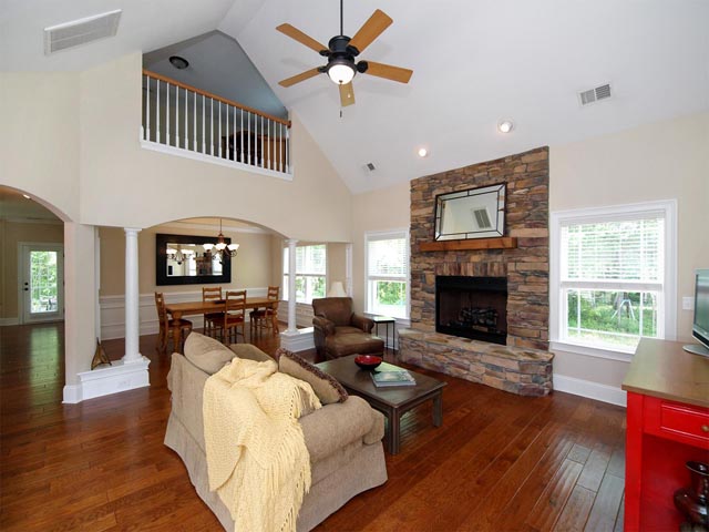 Spectacular great room with stone fireplace and loft overlook