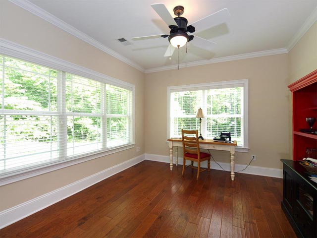 Sunroom with view of private backyard