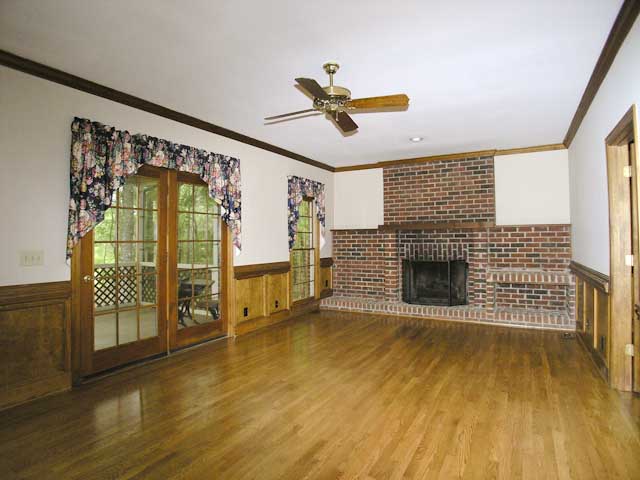 Great room with fireplace and access to screen porch