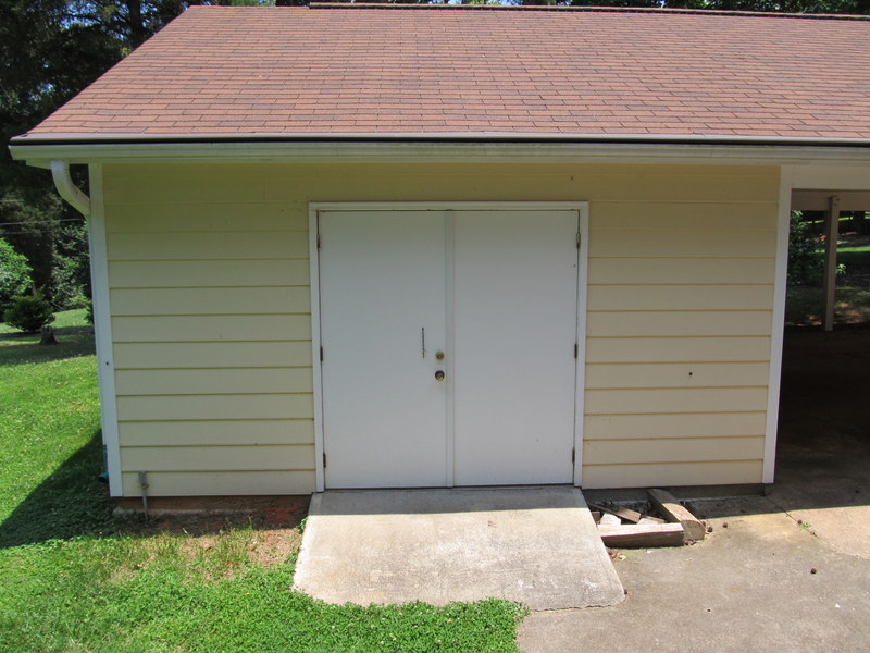 Carport with attached workshop