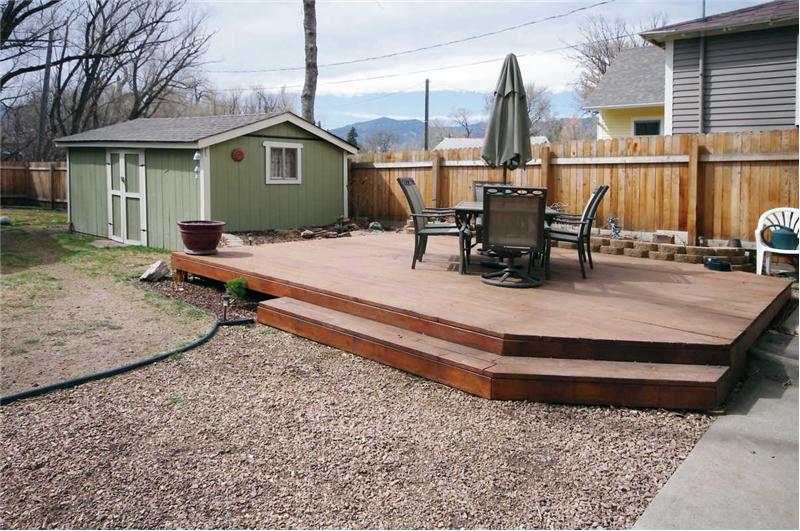Backyard with large deck and storage shed