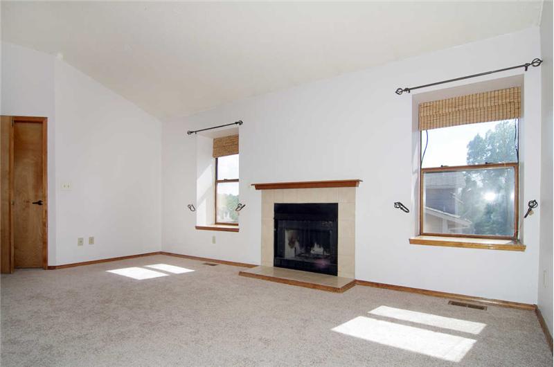 Master bedroom has an adjoining 5-piece bath, large walk-in closet, and wood burning fireplace.