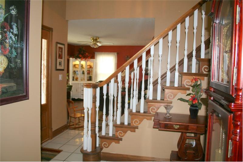 White Spindled Staircase with wood carving