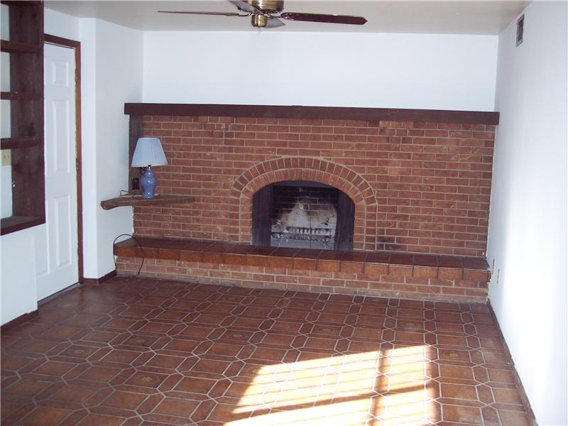Walk-out to back yard, wood burning fireplace