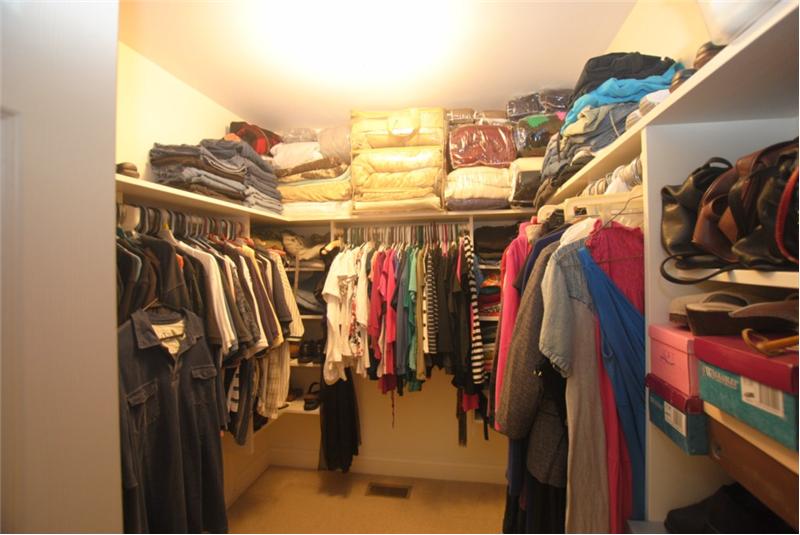One of two walk-in closets in master