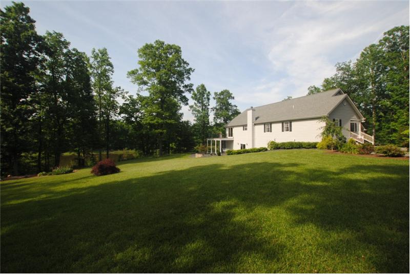 Landscaped yard stretching to the lake