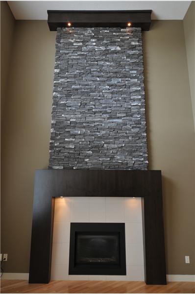 The gas fireplace extends to the second floor.