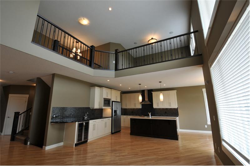 The second floor loft overlooks the canal and the living room.