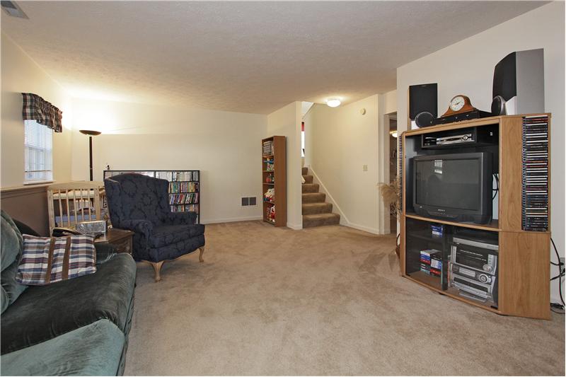 Family room on lower level with room for game area.
