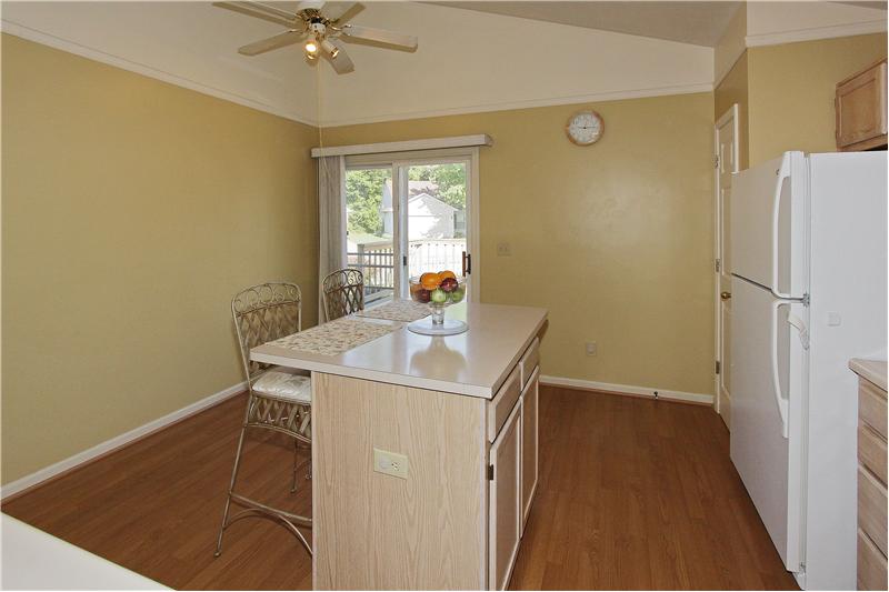 Workable kitchen with lots of cabinets.