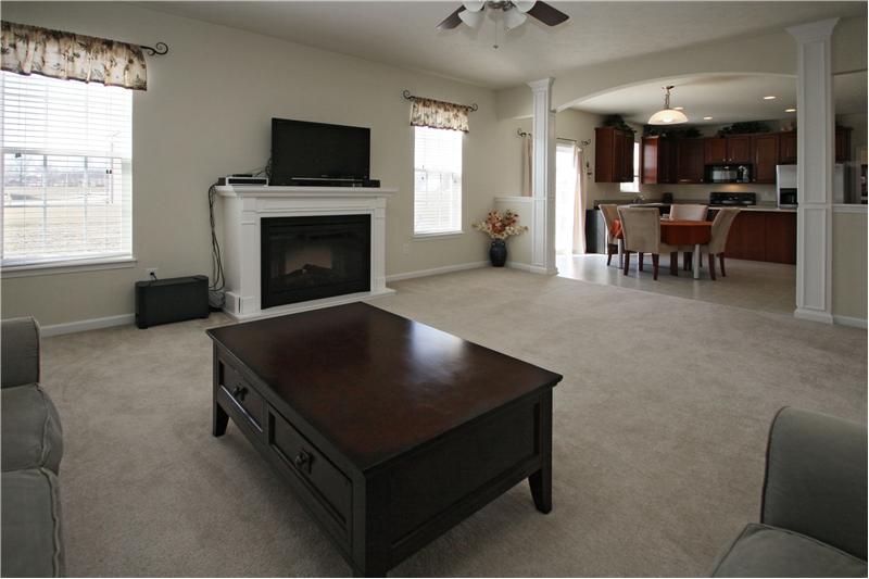 Family room with cozy fireplace.
