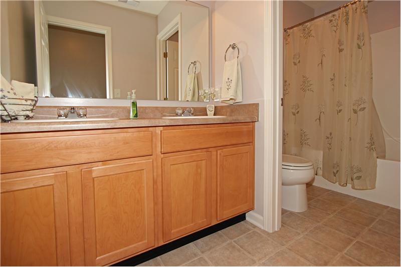 Hall bathroom upstairs, double sinks and seperate room for toilet & shower.