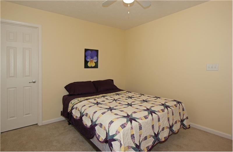 Bedroom 2 over head light/fan and walk in closet.