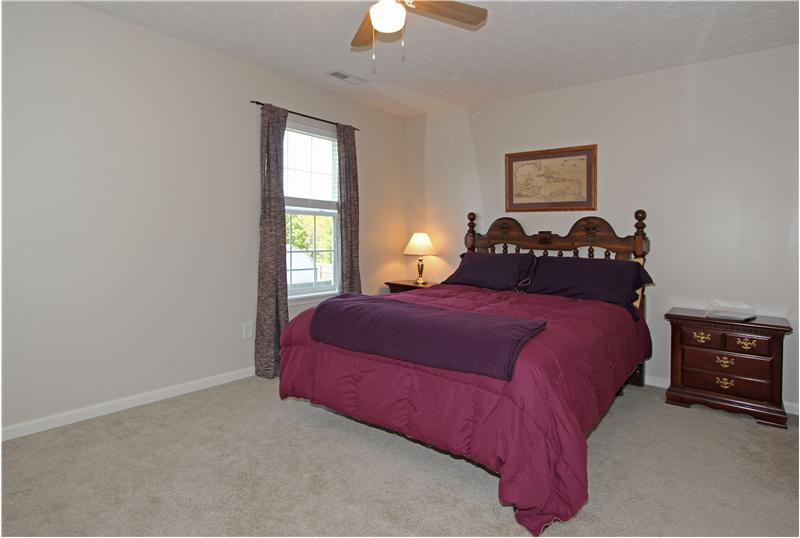 Bedroom 4, over head lighting/fan and walk in closet.