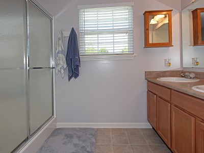 Master bathroom includes double sinks, shower and a water closet.