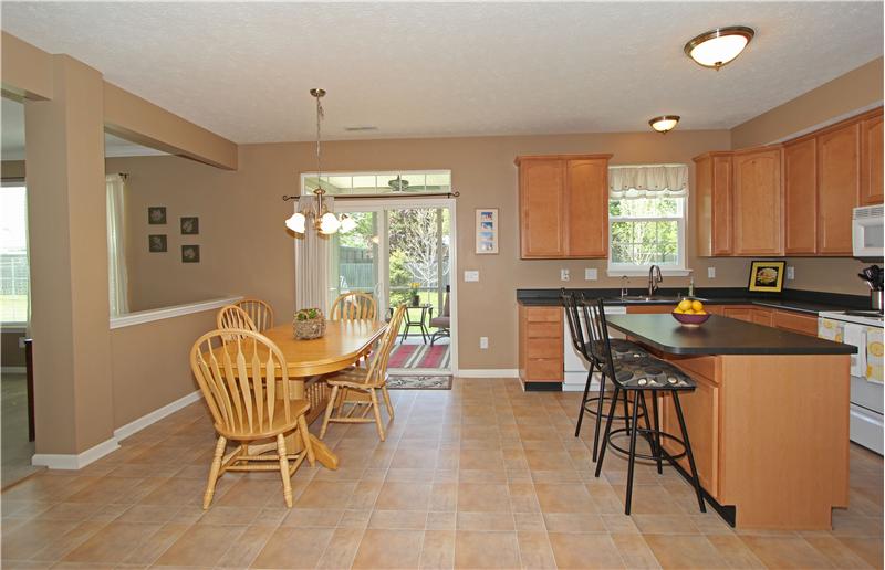 Breakfast area over looks screened in back porch.