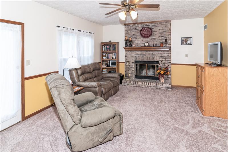 Warm and inviting brick fireplace.