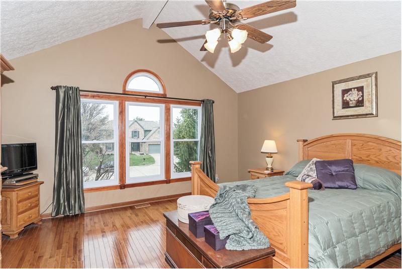 Large master bedroom w/beautiful hardwood floors.