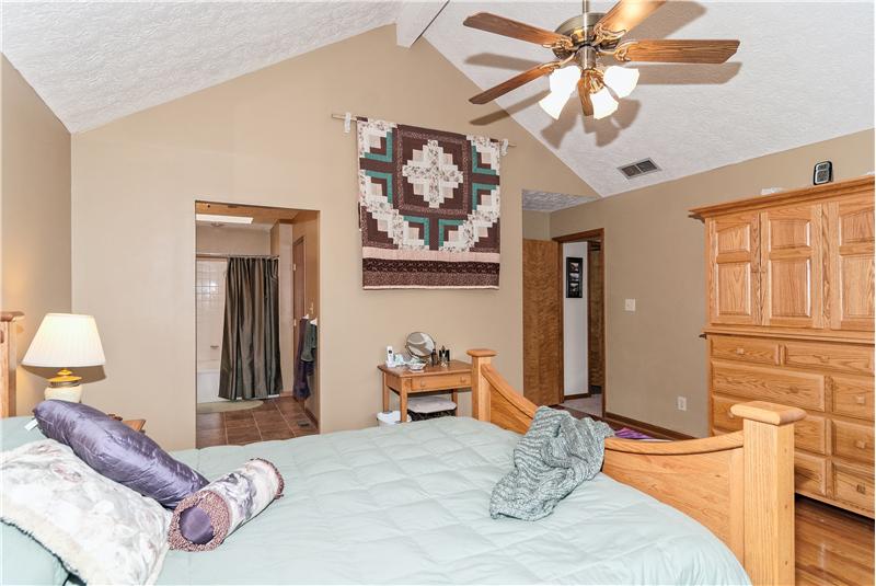 Master bedroom has cathedral ceilng.