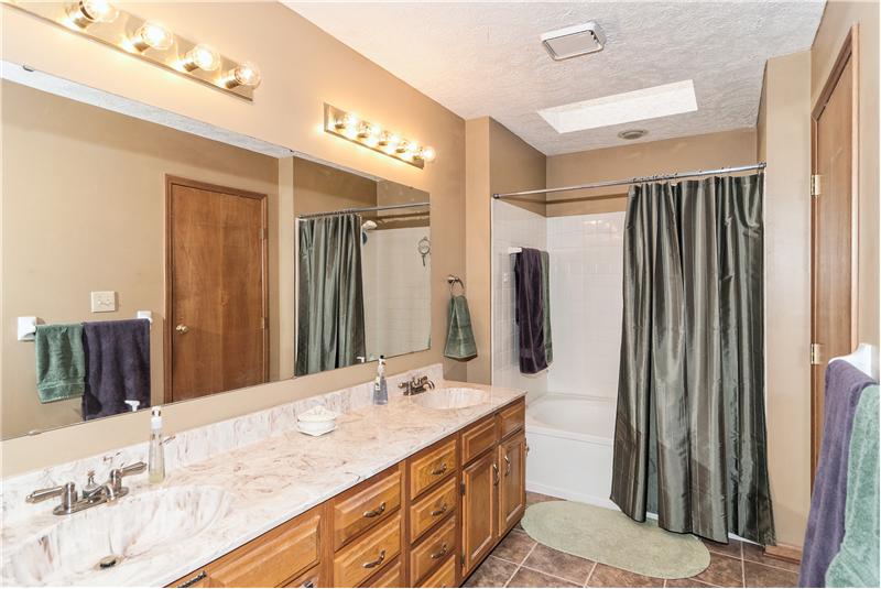 Master bathroom has double sinks, garden tub & walk-in closet.
