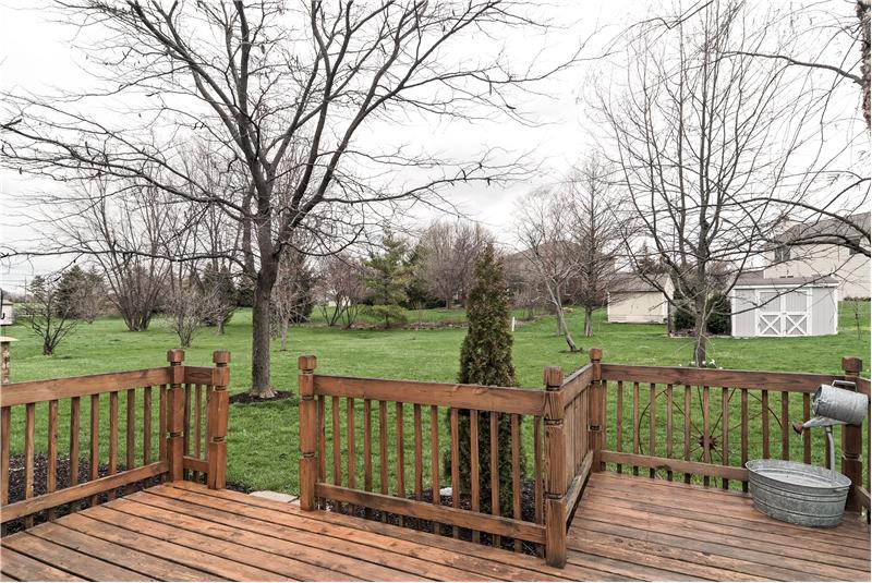 Relax on your deck overlooking private back yard.