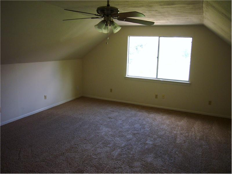 Huge master bedroom has room for a seating area