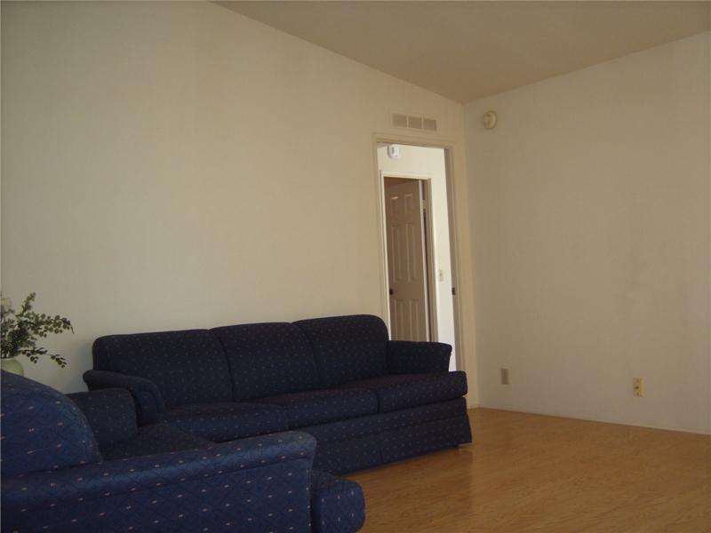 Famill room with new flooring and views of private yard