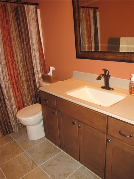 Remodeled Hall Bath has Tile floor