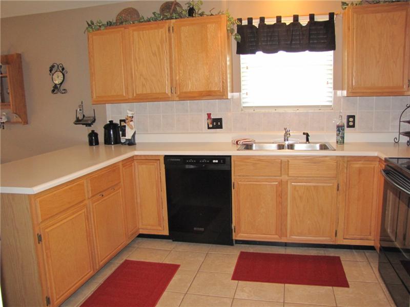Kitchen has a ceramic tile floor