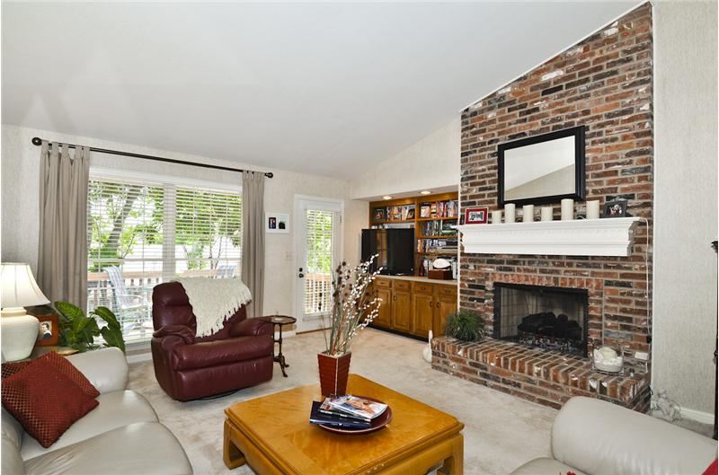 Great Room with Gas fireplace, built-in Bookcase, door to the Deck!