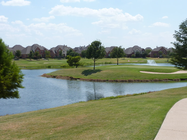 Enjoy views of the green grass and clear blue ponds!