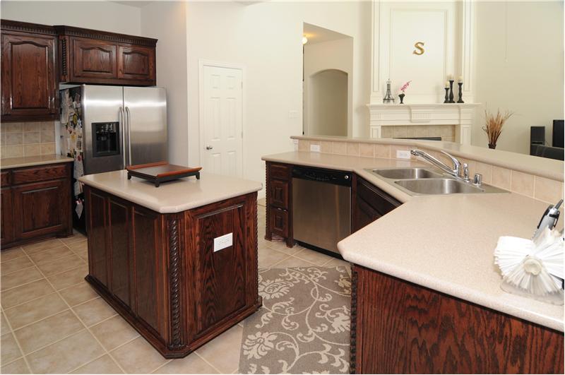 Kitchen is complete with stainless steel appliances including a double oven.