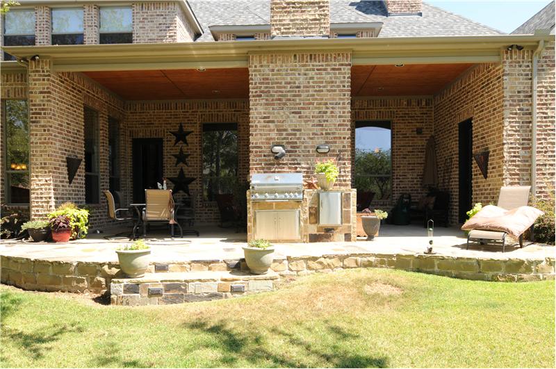 Enjoy a fun BBQ with guests on the back flagstone patio.