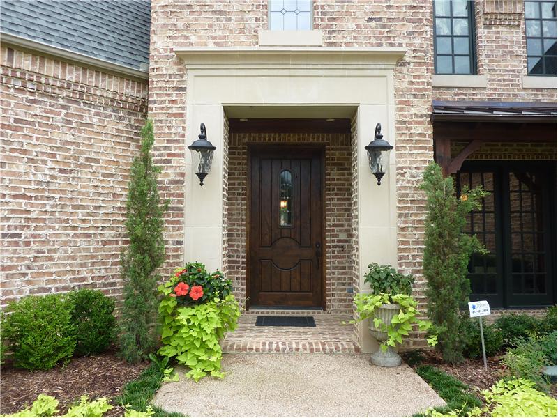 Enter your dream home in the grand entrance with covered porch.