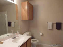 Bathroom with large mirror and lots of space.