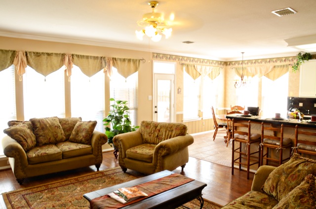 Living room has beautiful and easy to clean hardwood floors!