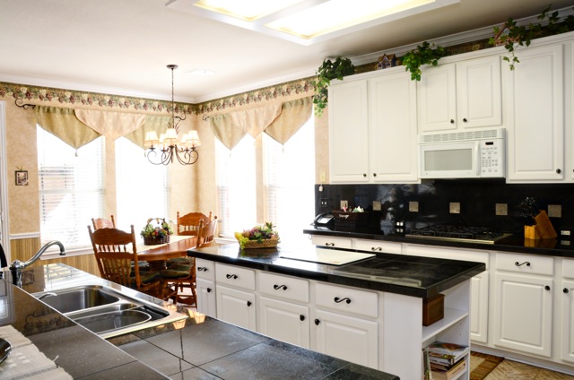 The kitchen is remodeled and upgraded with unique Italian flooring.