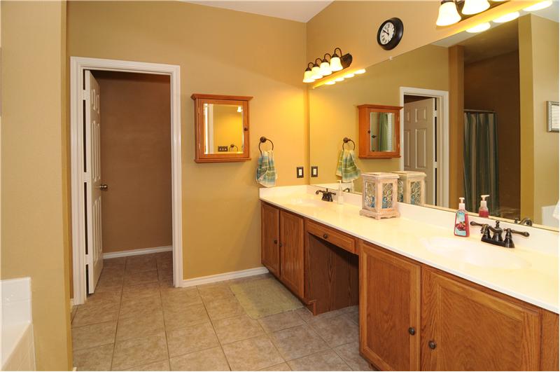 The dual vanities are a nice touch to the elegant bathroom.
