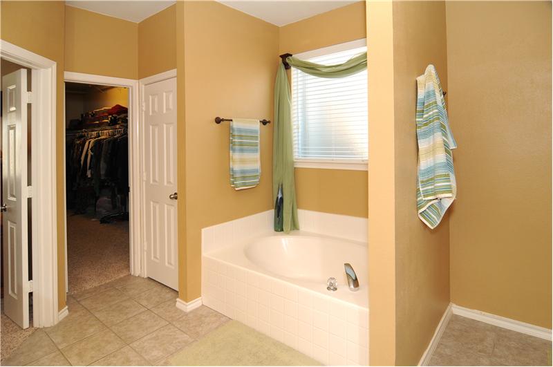 Master bath has a garden tub and separate shower.