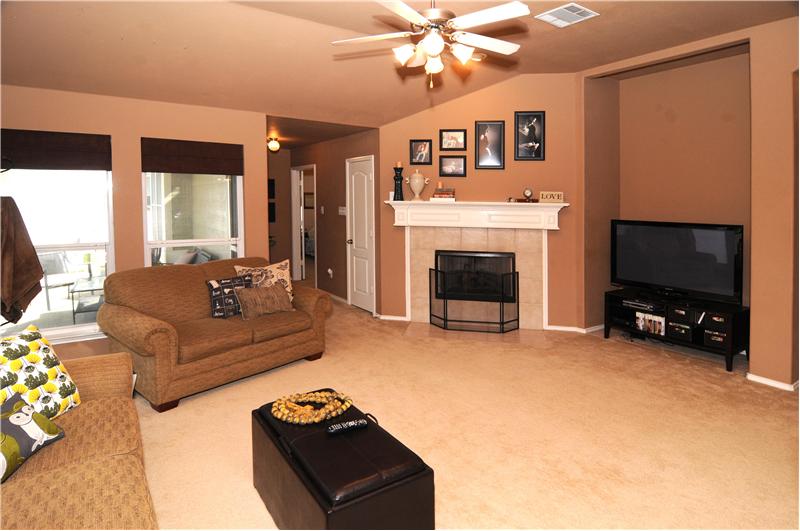 The living space has a fireplace to enjoy in the winter and a ceiling fan for the summer!