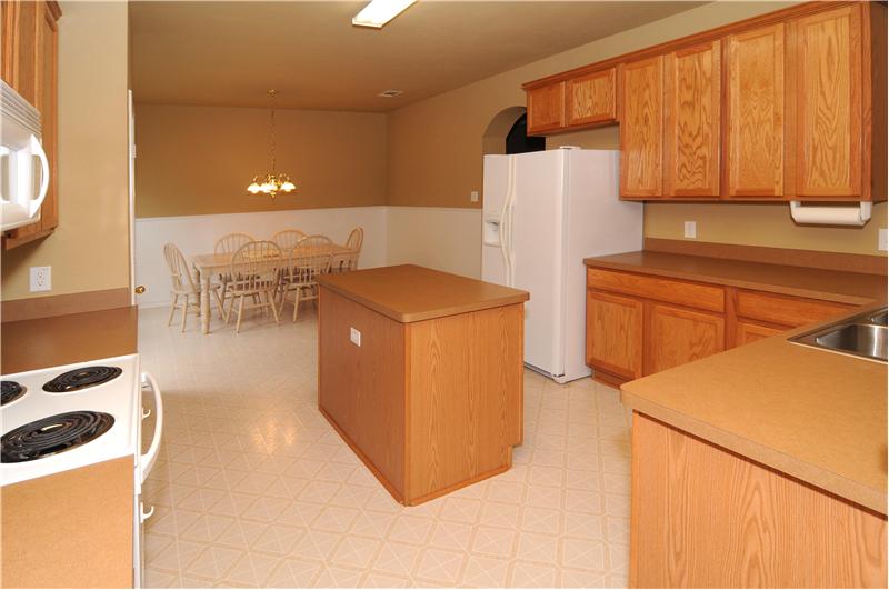 The kitchen is light and open with attached nook