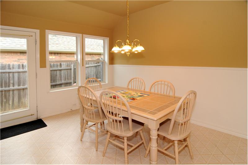 Views of the large backyard can be seen from the breakfast nook