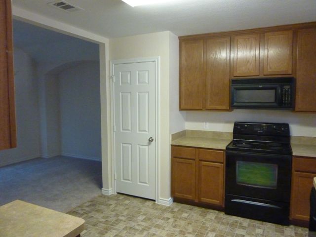 Appliances include stove, microwave, and dishwasher.