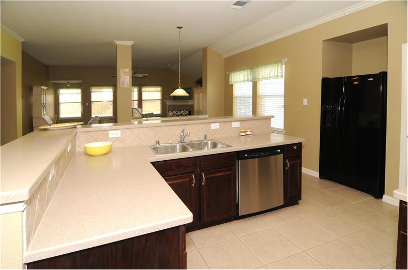 Notice the decorative lighting in the kitchen.