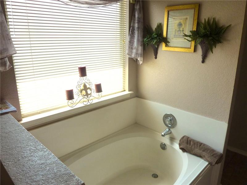 Relax in the garden tub in the master bathroom after a long day!