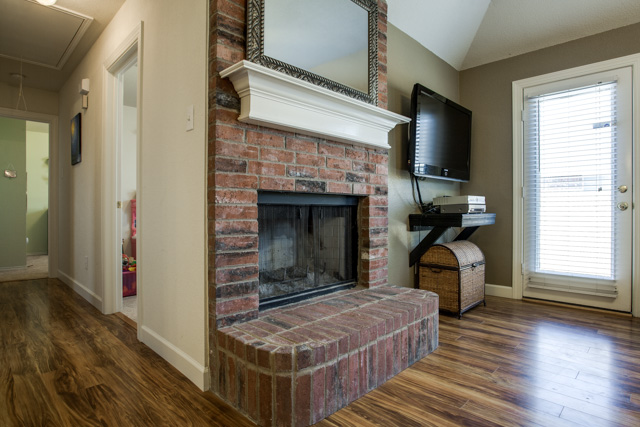 The beautiful brick fireplace will keep you warm in the winter.