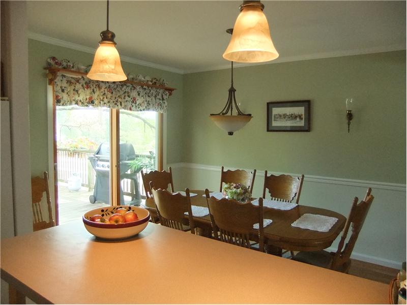 Kitchen breakfast bar, open to dining